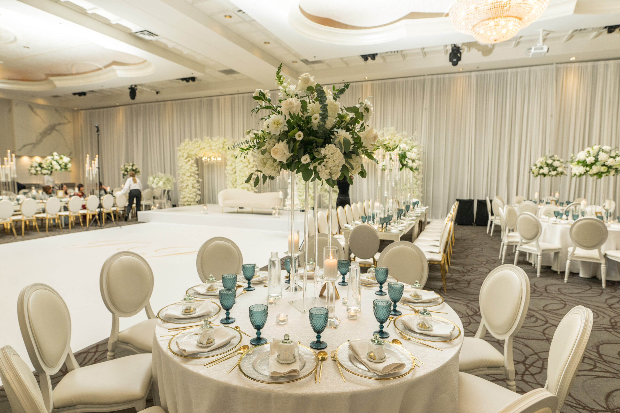 Wedding reception hall with elegant arch and decor, ready for your ceremony and celebration.