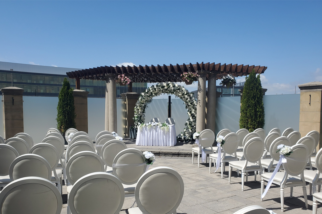 Anniversary celebration setup with floral arrangements and custom decor in our premium banquet hall.