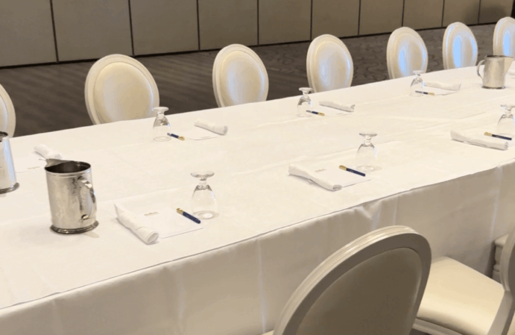 Wedding reception hall with elegant arch and decor, ready for your ceremony and celebration.