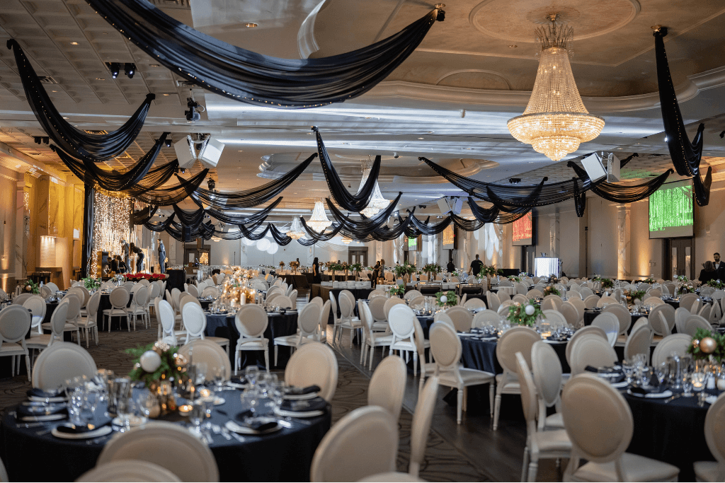 A trade show floor with different booths and companies showing their products.