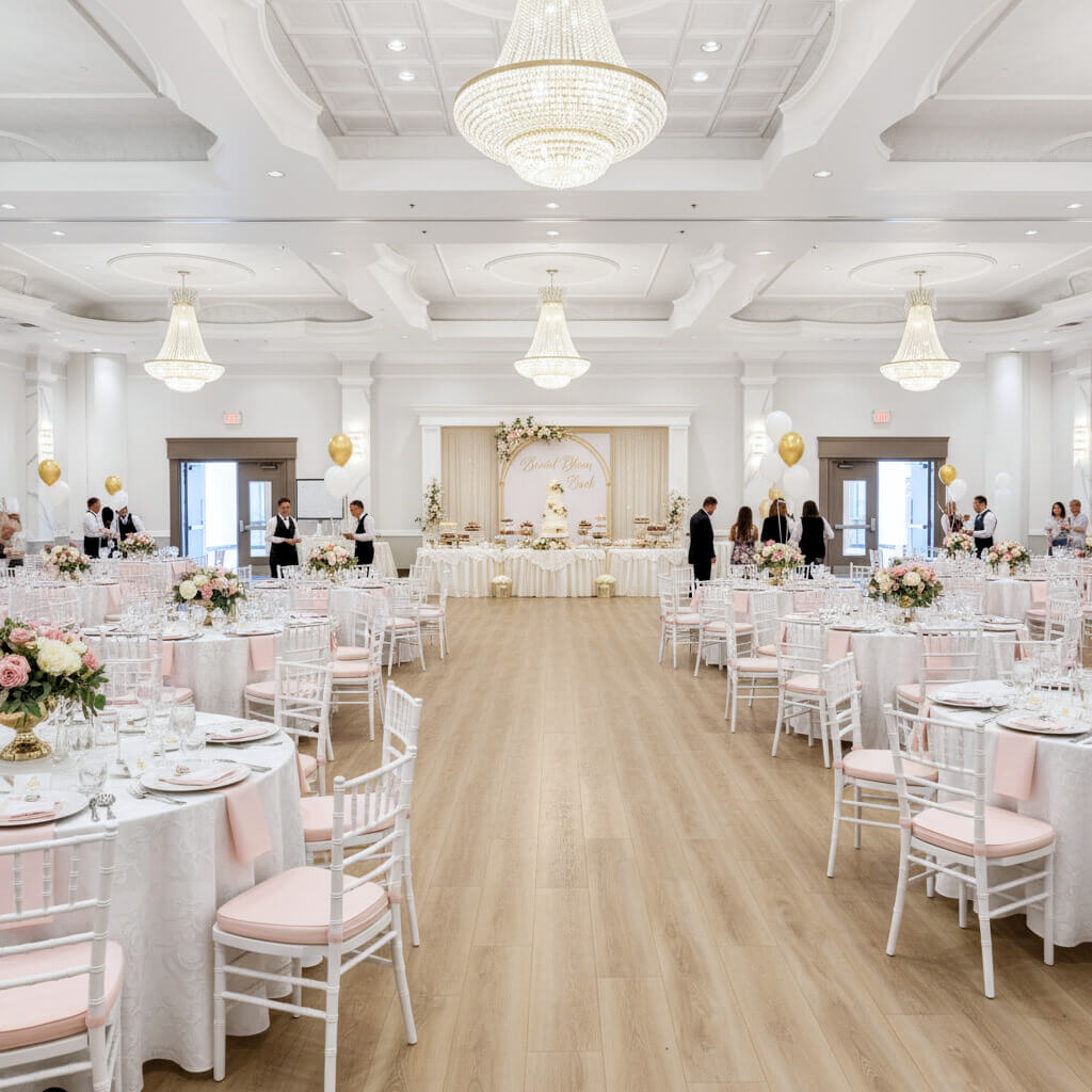 Grand ballroom with crystal chandeliers and dance floor - ideal for weddings and galas in the GTA.