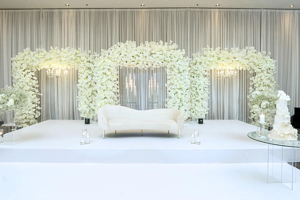 Wedding reception setup with decorated tables, centerpieces, and dance floor in our banquet hall.